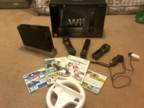 Black Nintendo Wii with motion Plus and 4 games